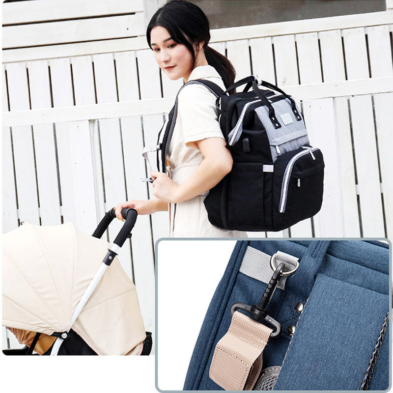 Spacious Diaper Bag with Built-in Foldable Crib